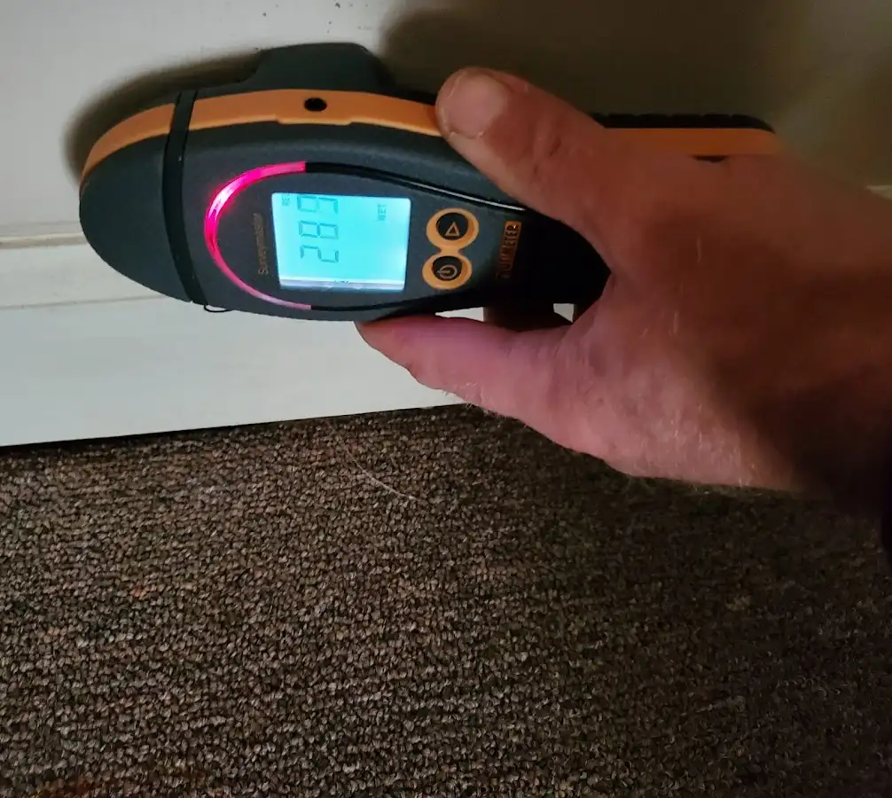Moisture detection at baseboard during Storm Damage Restoration in Orange Park